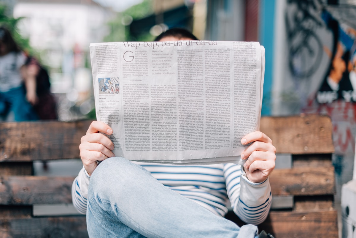 A stack of folded newspapers